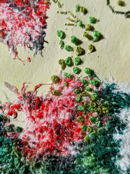 A wild composition of French knots and other stitches in red and green and magenta colourshapes on a piece of decomposed fabric. The fabric is glued on plant dyed, yellowish art paper. The composition forms a rose flower in an impressionistic way.