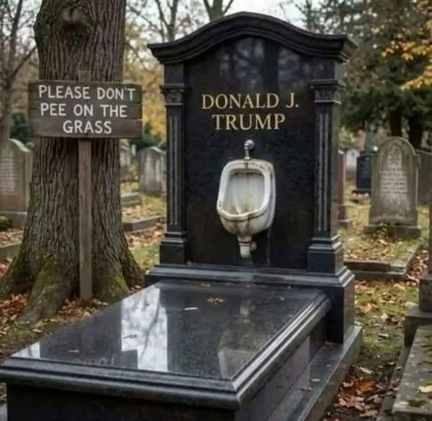 A black marble grave and tombstone. The tombstone has a white flush urinal mounted on it, with "DONALD J. TRUMP" in gold letters on the stone. A nearby sign reads "PLEASE DON'T PEE ON THE GRASS".